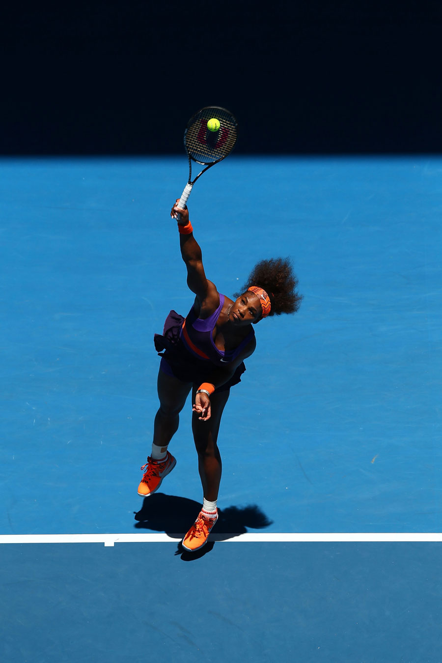 Serena Williams hits a serve