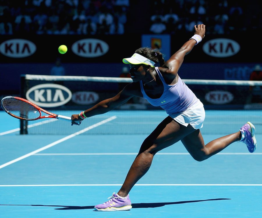 Sloane Stephens stretches for a backhand