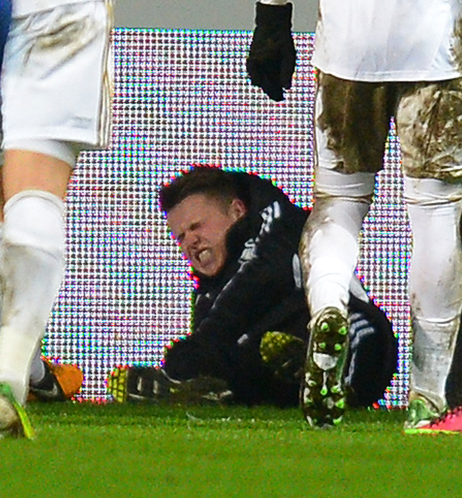 A ballboy lies on the ground after an altercation with Eden Hazard