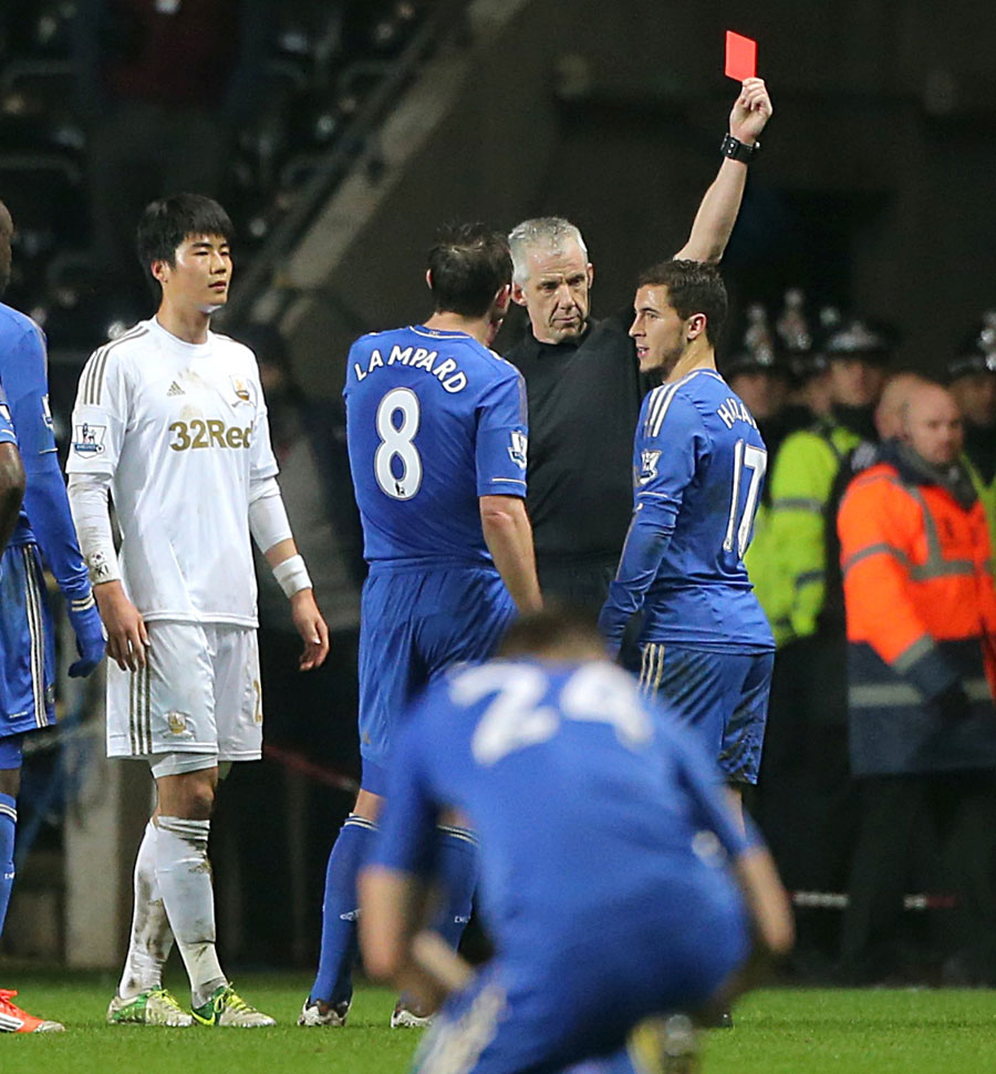 Eden Hazard receives a red card from referee Chris Foy
