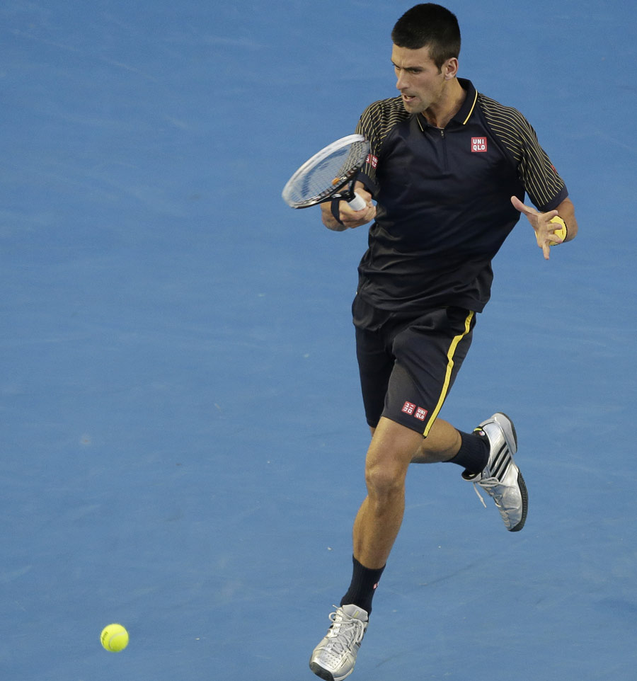 Novak Djokovic powers back a forehand