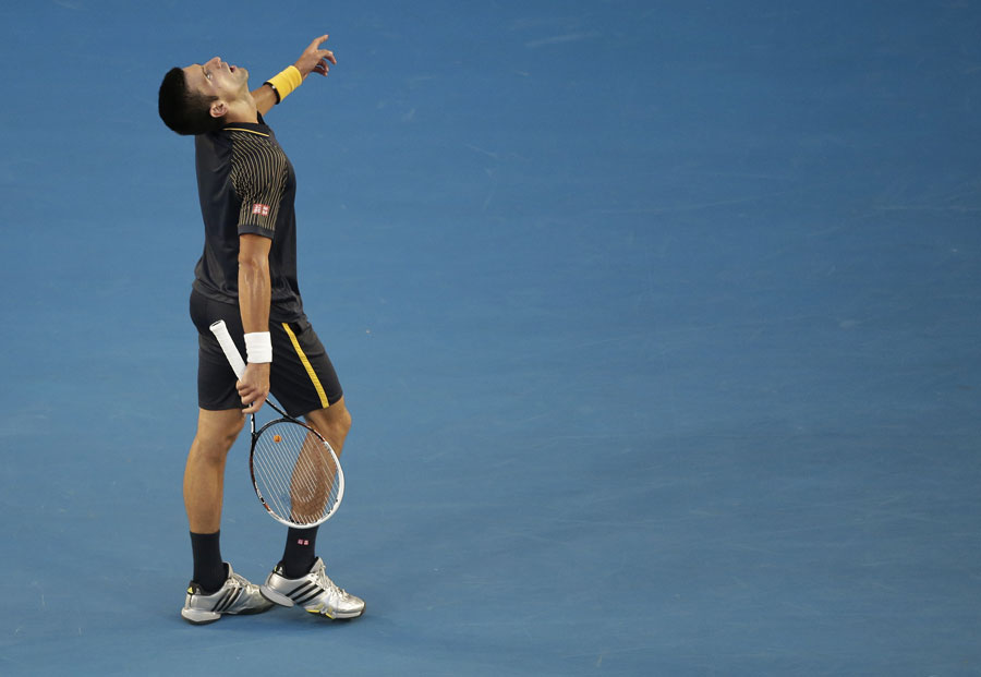Novak Djokovic looks to the sky in frustration