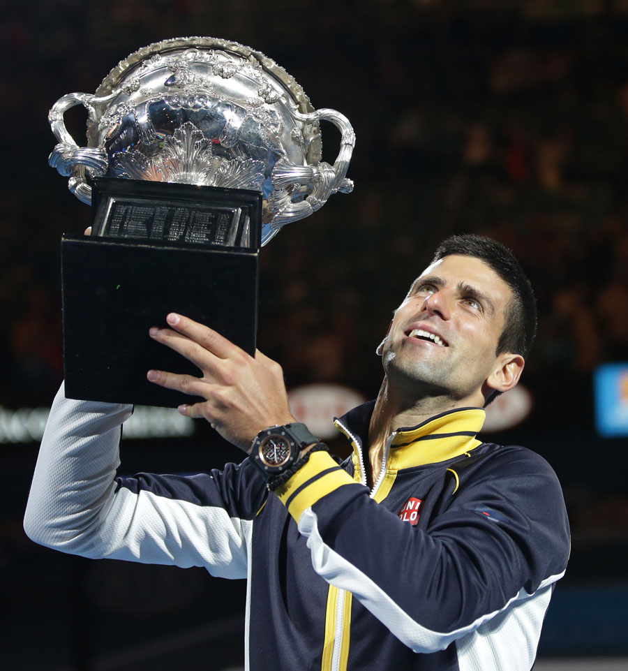 Novak Djokovic lifts the Norman Brookes Challenge Cup