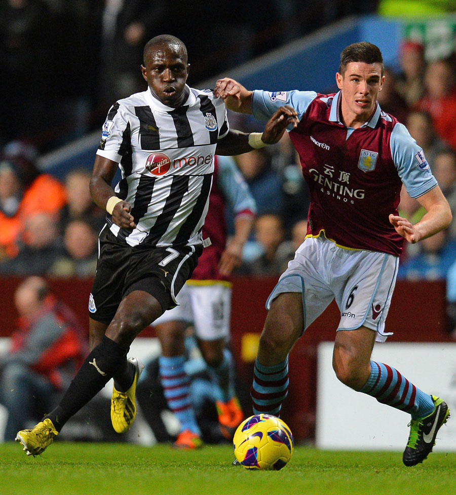 Aston Villa's Ciaran Clark vies for the ball with Moussa Sissoko