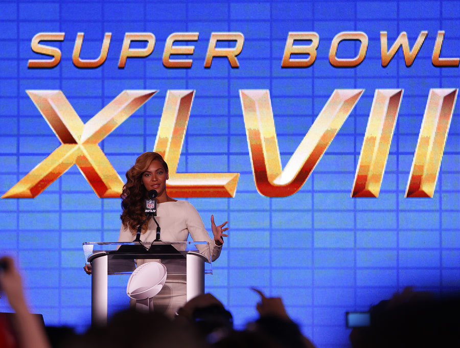 Beyonce addresses the media during a press conference for Super Bowl XLVII