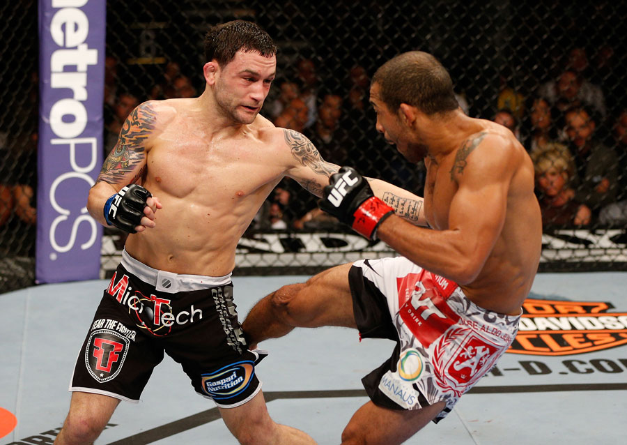 Frankie Edgar punches Jose Aldo during their featherweight title fight