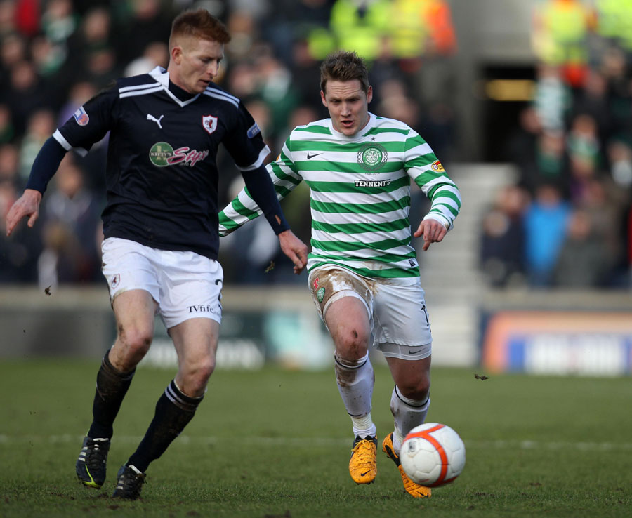 Celtic's Kris Commons and Raith's Jason Thomson in action