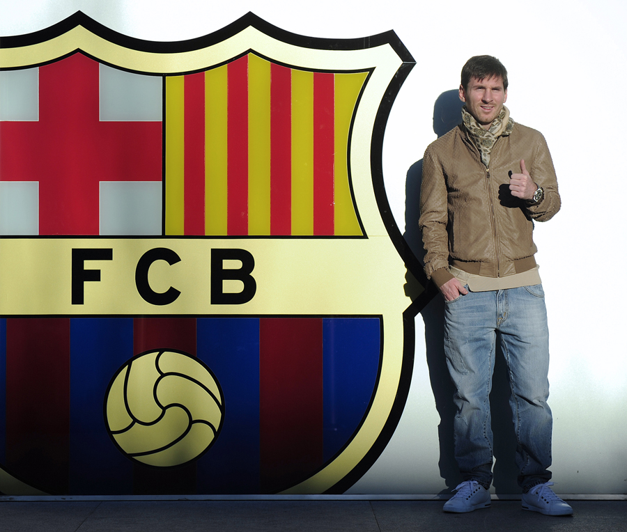 Lionel Messi poses for pictures