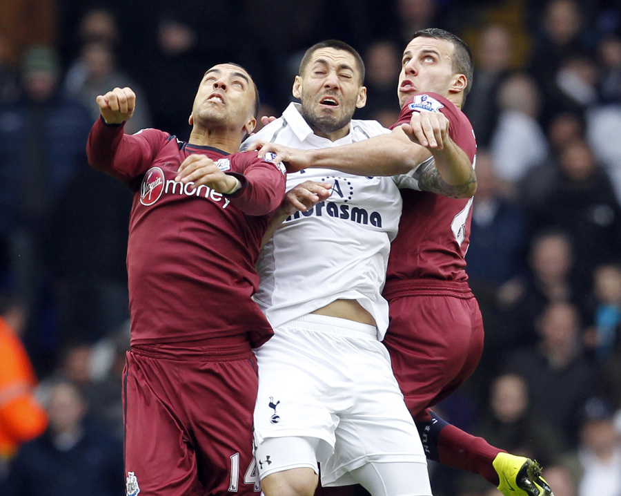 Clint Dempsey tussles with James Perch and Steven Taylor