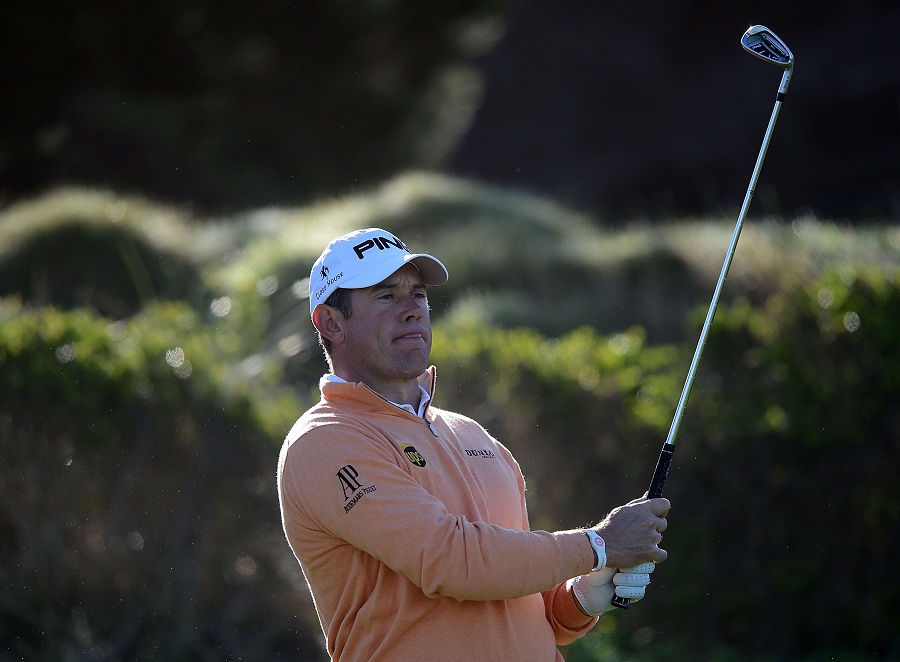 Lee Westwood hits his tee shot on the third hole