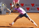 Rafael Nadal stretches for a backhand against Horacio Zeballos
