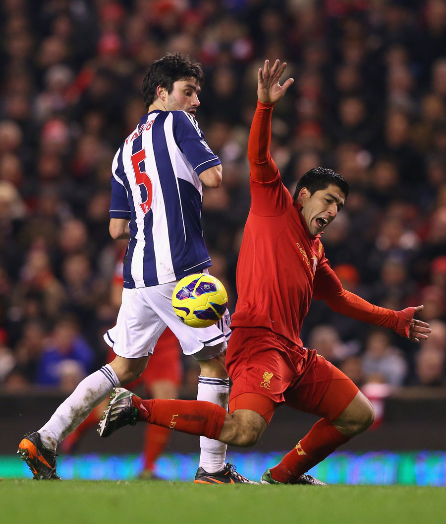 Luis Suarez falls to ground to win a penalty