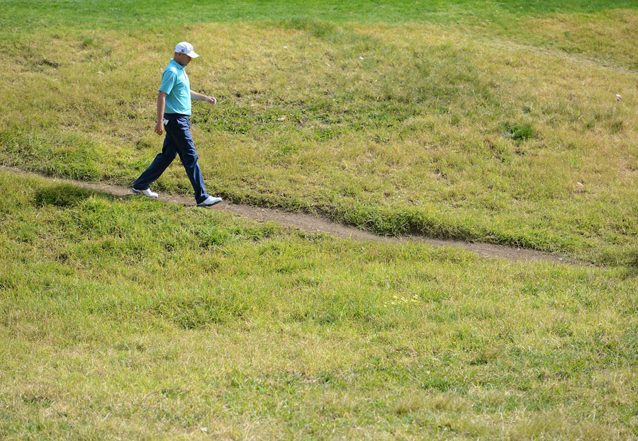 Bill Haas makes his way to the 12th green