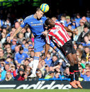Clayton Donaldson and John Terry battle for the ball in the air