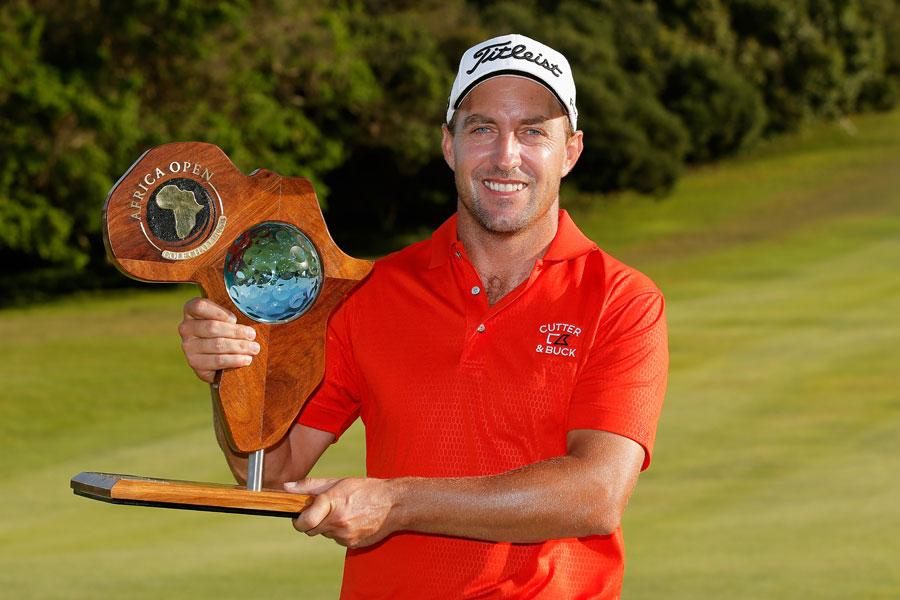 Darren Fichardt of South Africa celebrates with the Africa Open trophy