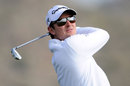 Justin Rose hits his tee shot on the third hole