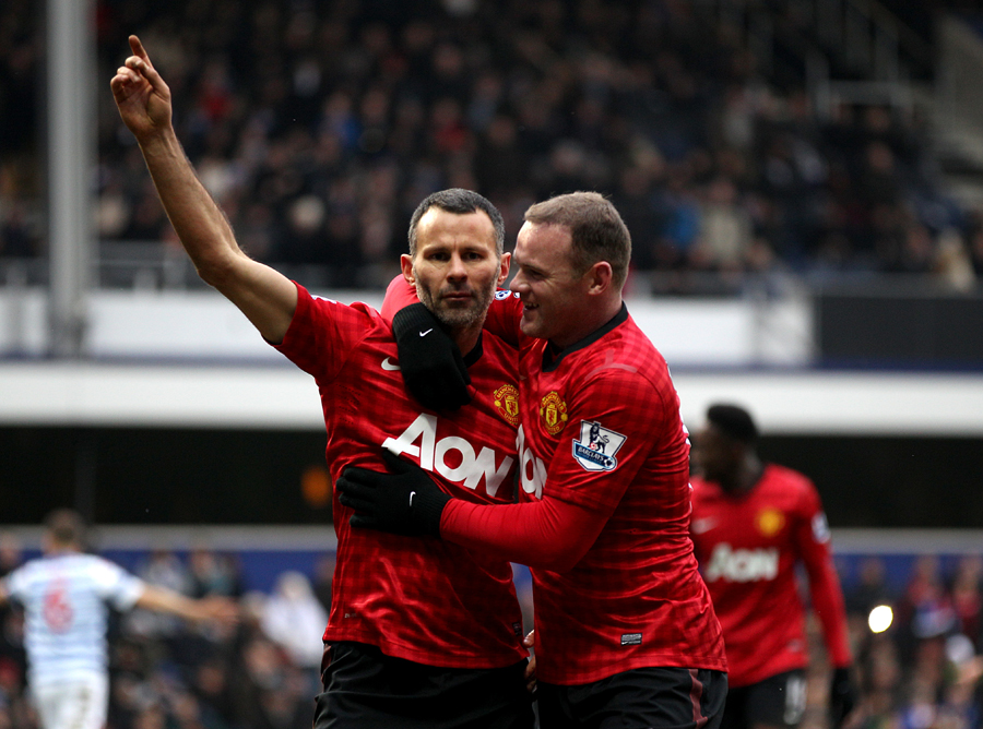 Ryan Giggs is congratulated by Wayne Rooney