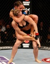 Liz Carmouche attempts to submit Ronda Rousey