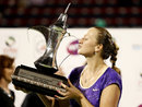 Petra Kvitova kisses the trophy after defeating Sara Errani