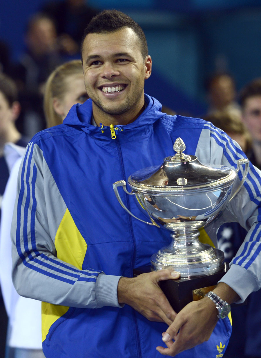 Jo-Wilfried Tsonga holds the trophy after winning the final
