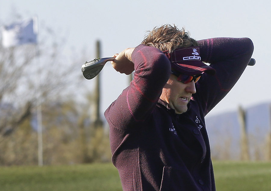 Ian Poulter reacts to a missed putt