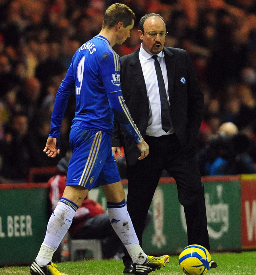Fernando Torres walks past Rafael Benitez 