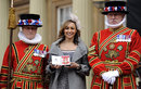 Jessica Ennis poses with members of the Yeoman of the Guard after she received a CBE,