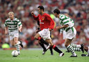 Ryan Giggs goes through the Celtic defence