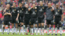 The Manchester United team watch during the penalty shoot-out