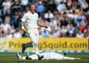 Hamish Rutherford lies on the ground behind Neil Wagner after taking a catch