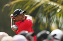 Tiger Woods watches his drive intently