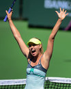 Maria Sharapova celebrates her victory over Caroline Wozniacki