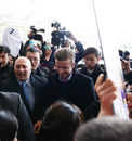 David Beckham is swamped by fans and media