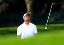 Tiger Woods throws his club in frustration