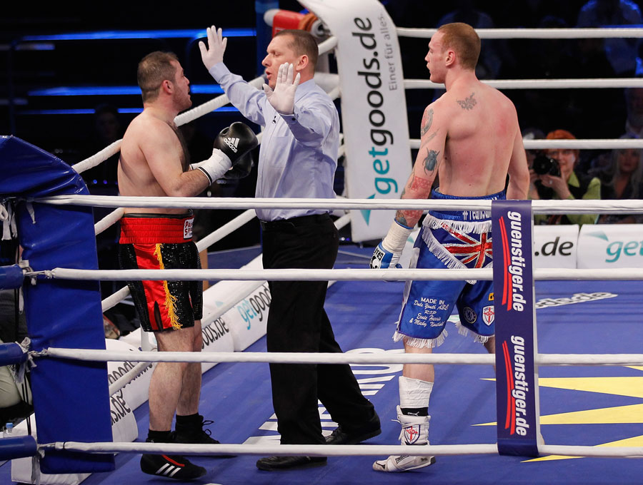 The ring referee stops the fight between Baker Barakat and George Groves