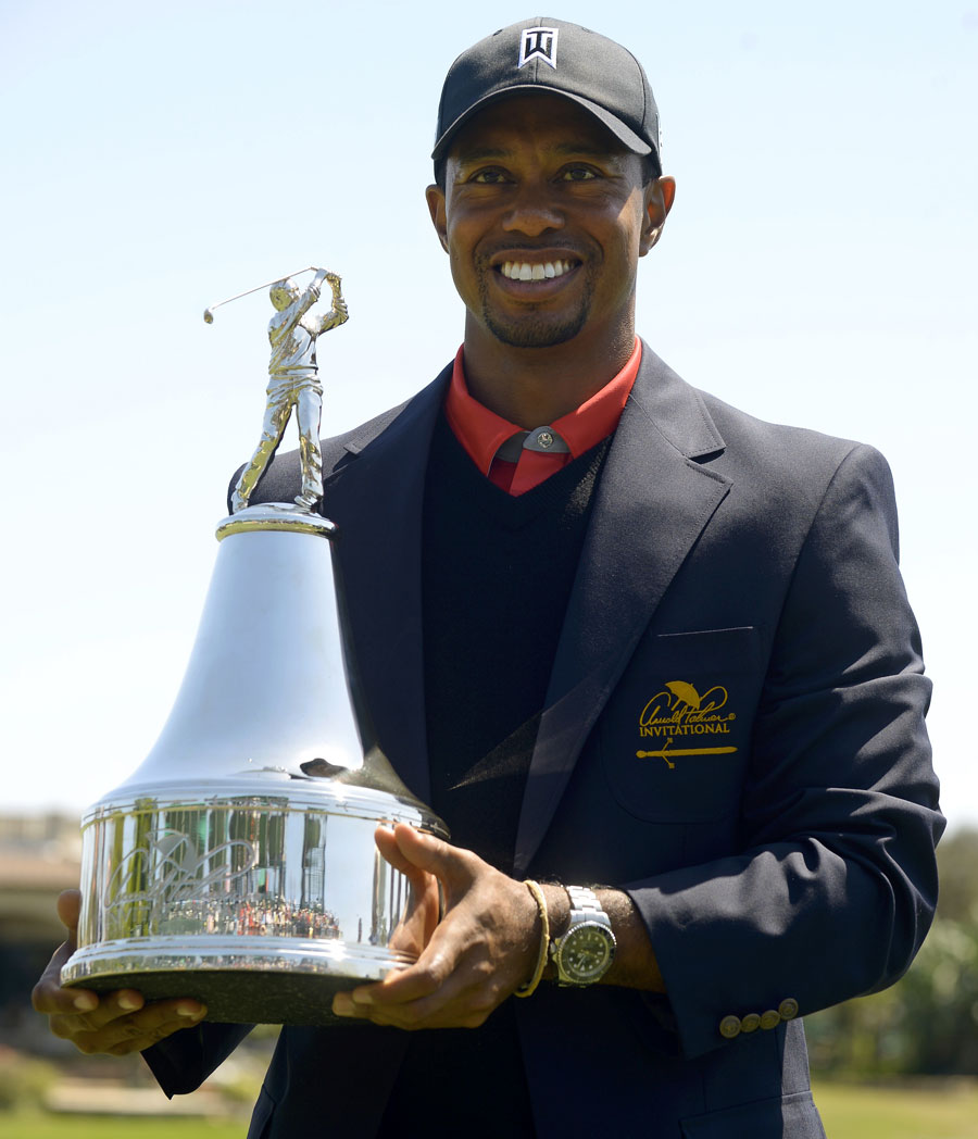 Tiger Woods holds the championship trophy