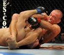 Georges St-Pierre goes for the armbar against Dan Hardy