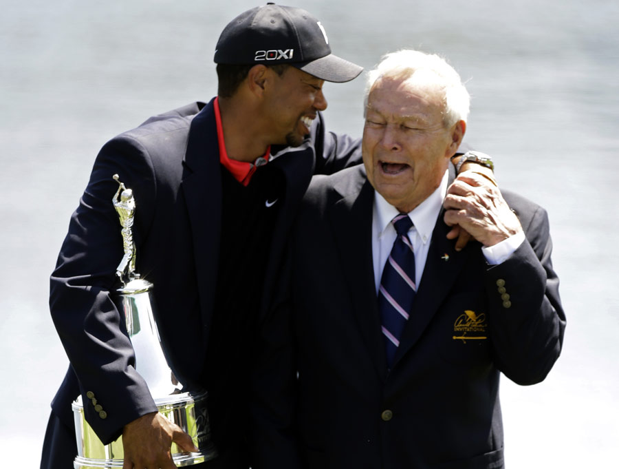 Tiger Woods shares a joke with Arnold Palmer