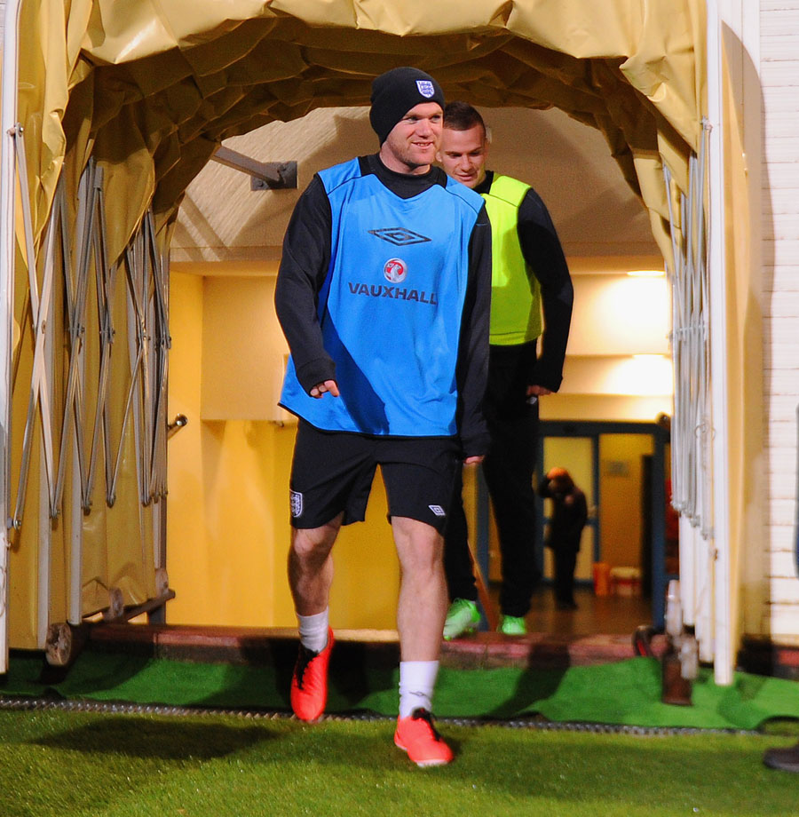 Wayne Rooney and Tom Cleverley arrive at an England training session