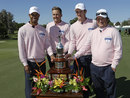 Tiger Woods, Ian Poulter, Justin Rose and Tim Clark pose with the winner's trophy