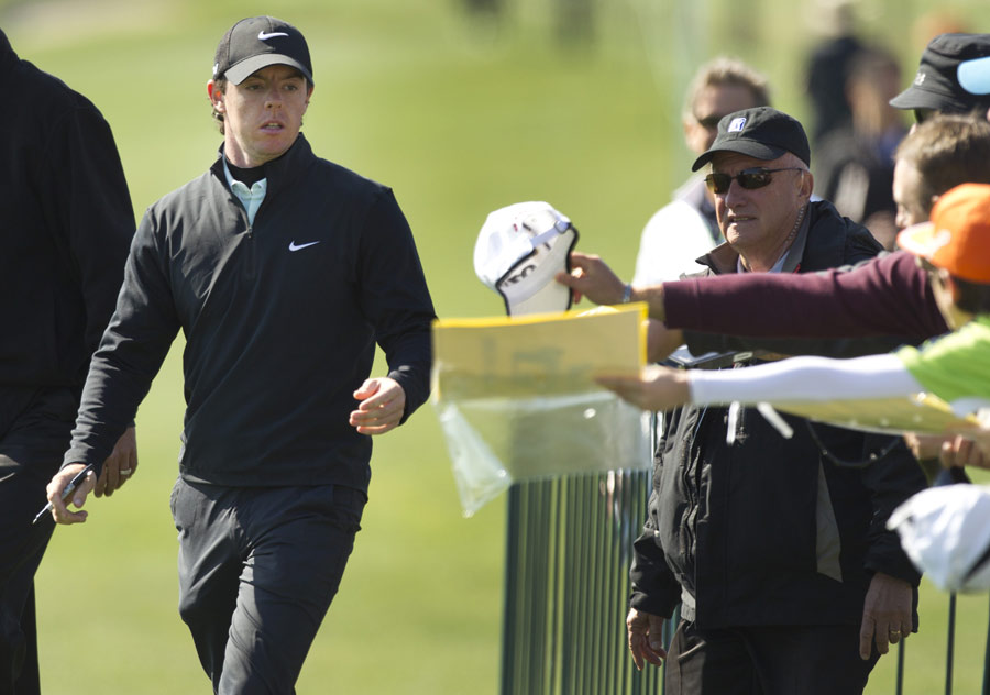 Rory McIlroy signs autographs for fans