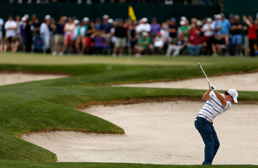 Rory McIlroy plays his shot from the bunker