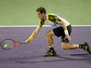 Andy Murray stretches to play a forehand against Richard Gasquet