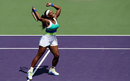 Serena Williams jumping with delight after beating Maria Sharapova