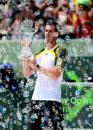 Andy Murray holds the Sony Open trophy after beating David Ferrer in the final