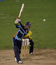 David Miller launches down the ground during his late-innings charge