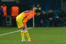 Lionel Messi clutches his leg