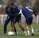 Gareth Bale shares a joke with Mousa Dembele during a training session