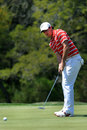 Rory McIlroy watches his putt on the fifth hole