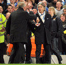 Roberto Mancini and Sir Alex Ferguson confront each other on the touchline